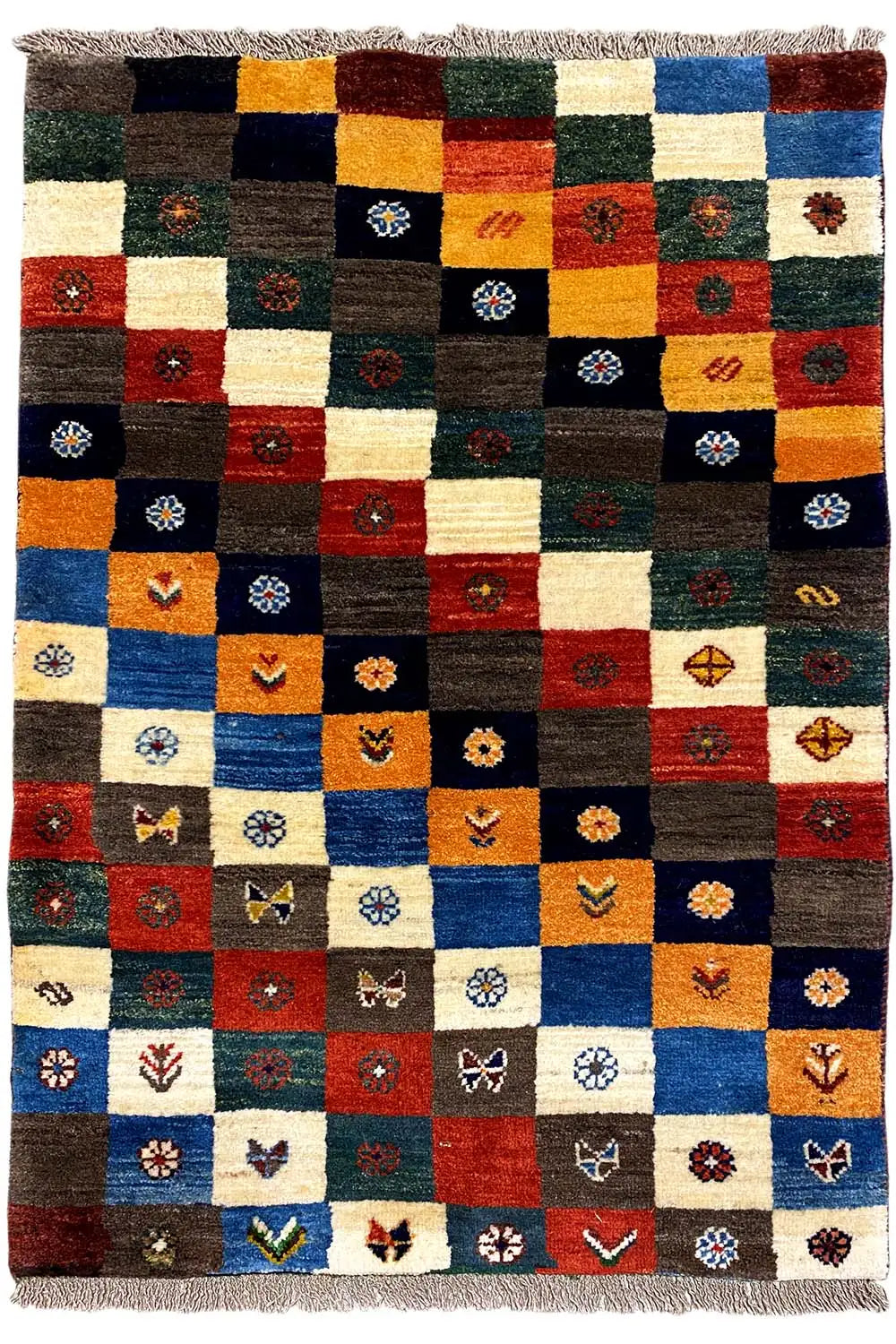 Gabbeh Lori rug with square color fields and small ornaments, with fringes on both sides