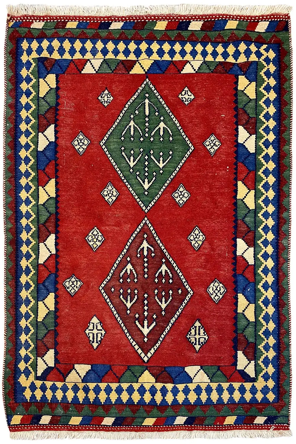 Multicolored kilim rug with a central diamond pattern, red background, and woven border