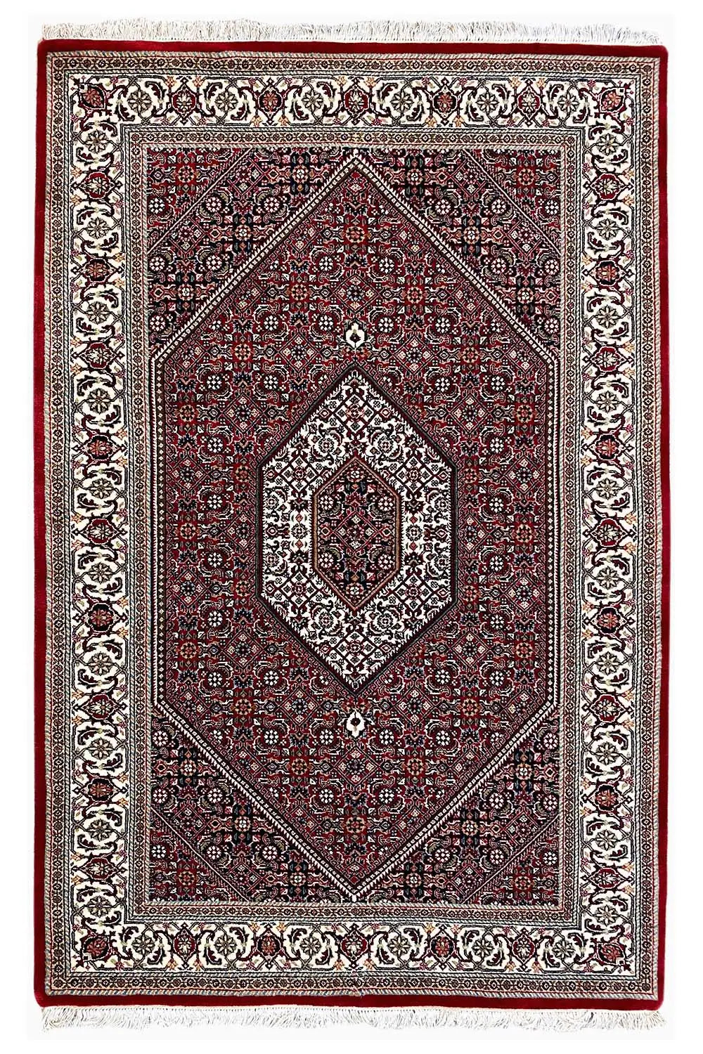 Rectangular Bidjar rug with a red field, diamond-shaped medallion, and decorative border