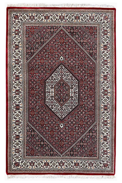 Rectangular Bidjar rug with a red field, diamond-shaped medallion, and decorative border