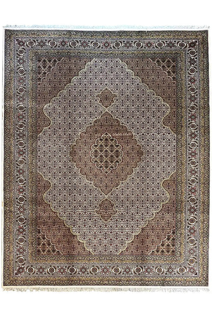Indo Tabriz rug with a central medallion and ornamental border