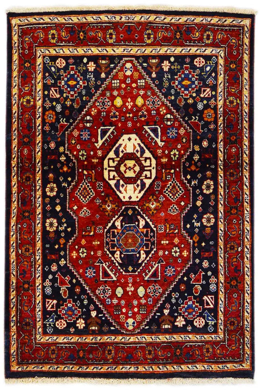 Rug shown from the front: red center with a blue decorative border and geometric motifs