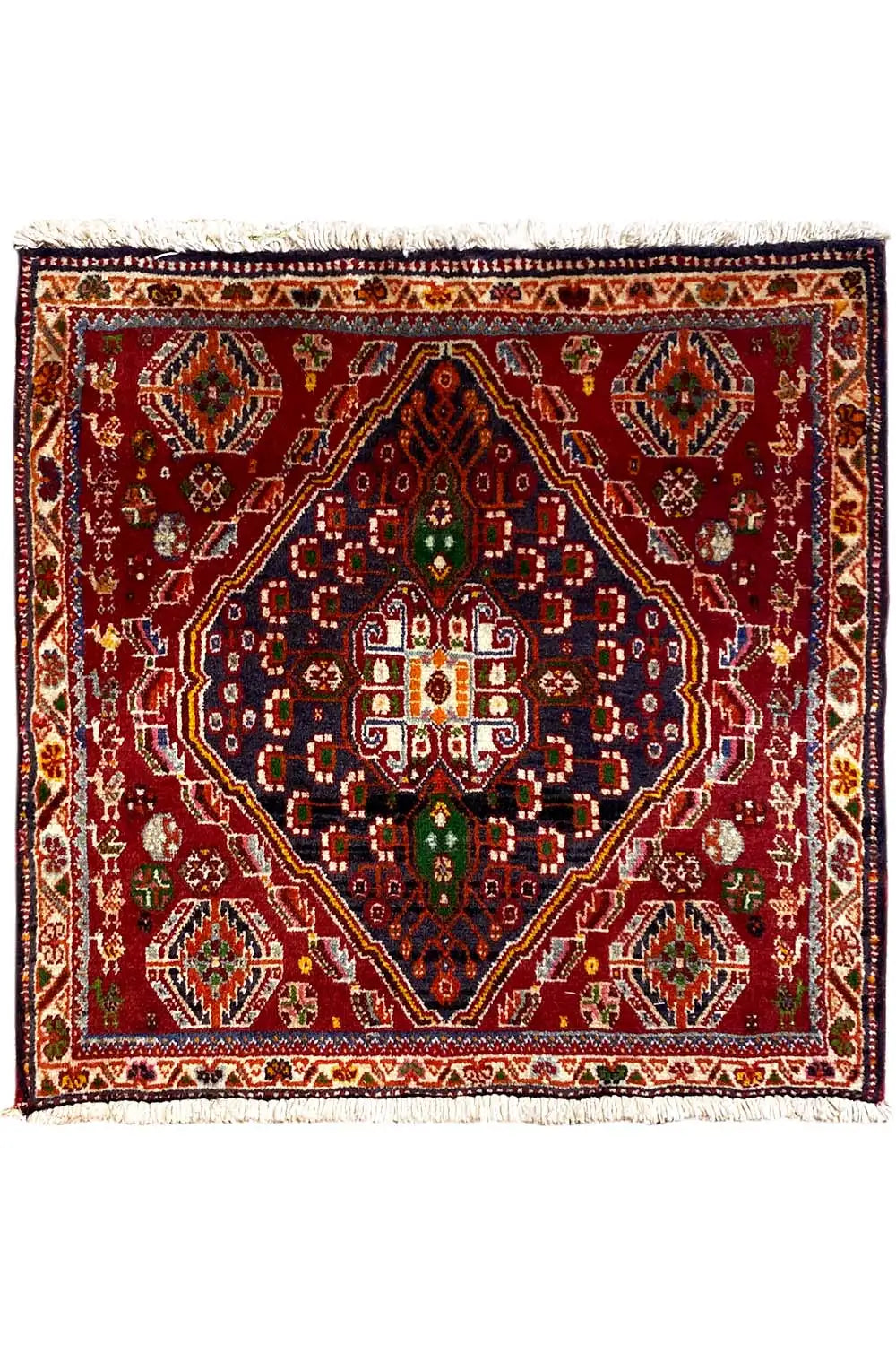 Reddish-brown rug with medallion pattern and fringe, 64×62 cm