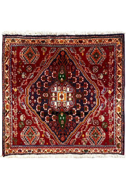 Reddish-brown rug with medallion pattern and fringe, 64×62 cm