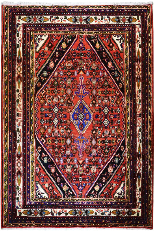 Oriental rug with a red central medallion and a border in gold, blue, and dark green