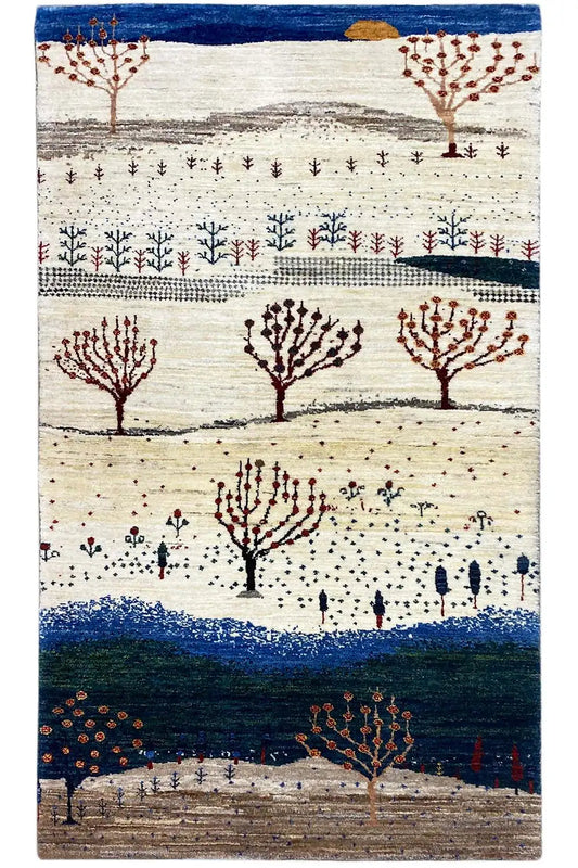 Rectangular Gabbeh rug with tree motifs, a cream-colored background and blue border