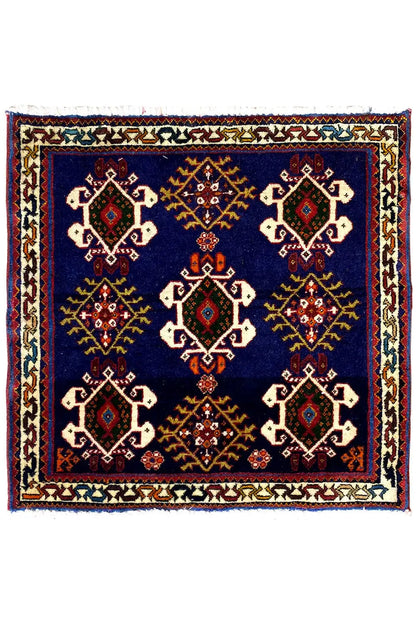 Rug 61x60 cm with dark blue background and symmetrical diamond design