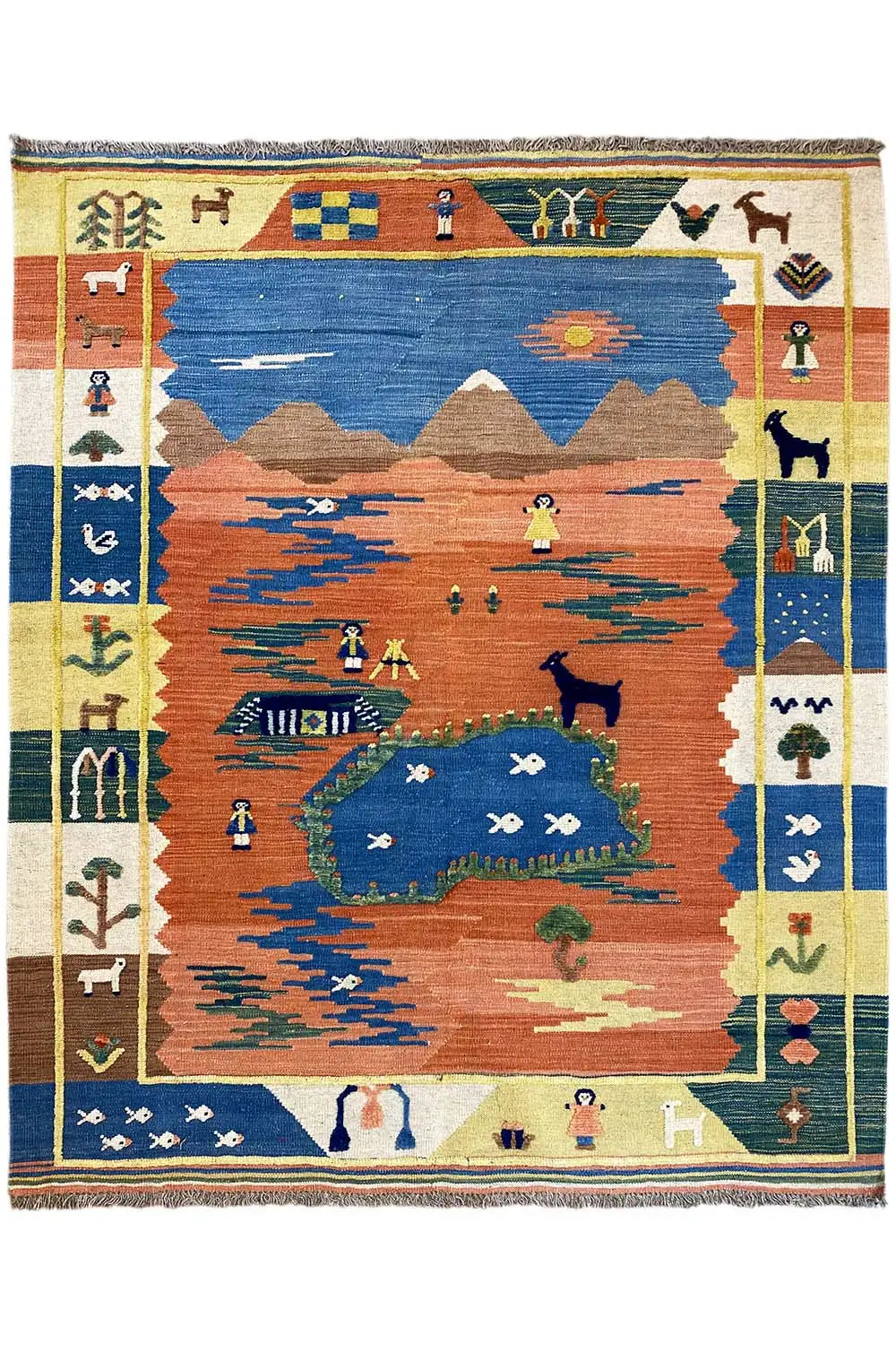 Blue and rust-red kilim rug with a landscape design, framed border with symbols