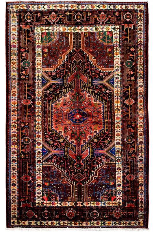 Hamadan rug with a red medallion and geometric border, featuring colorful patterns