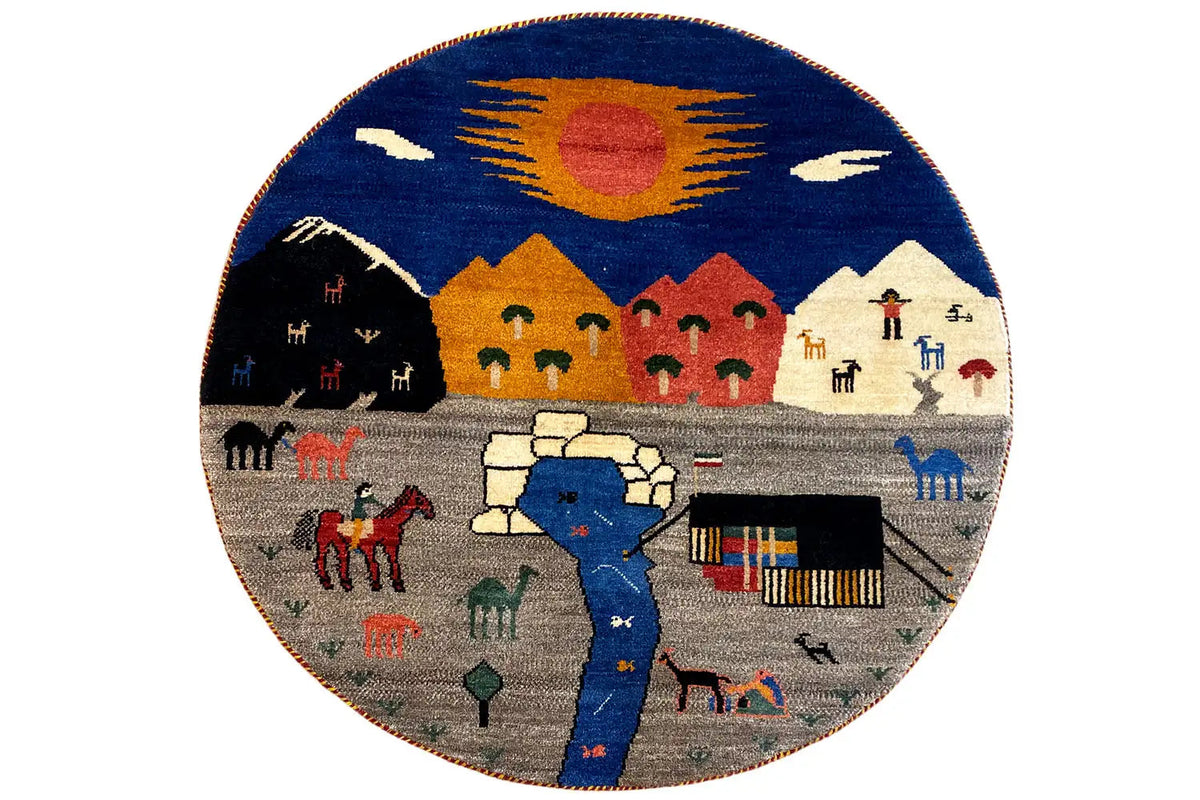 Round Gabbeh rug with a blue/gray/red figure and house pattern