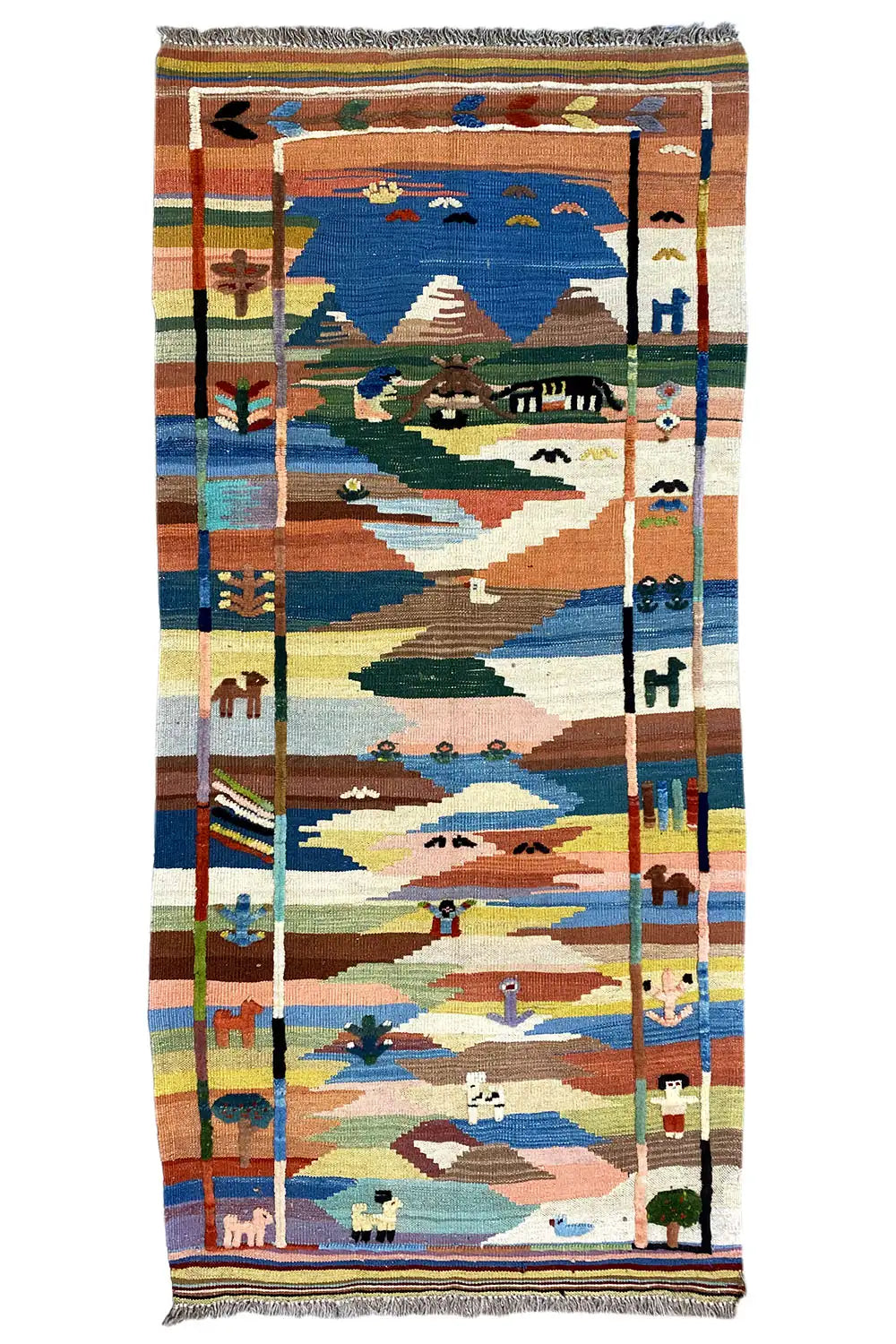 Thick kilim rug with a landscape design in blue, beige, green, and orange, with fringes all around