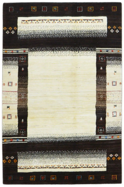 Gabbeh rug with a dark border, a cream-colored central area, and decorative trim