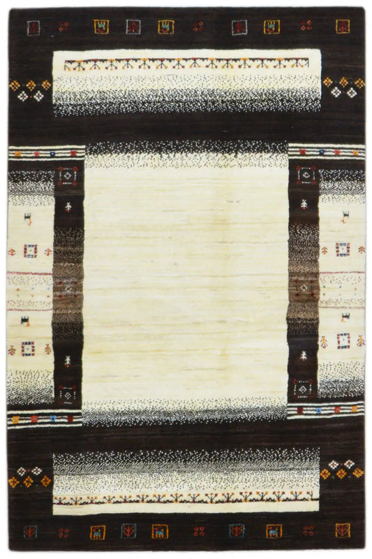 Gabbeh rug with a dark border, a cream-colored central area, and decorative trim