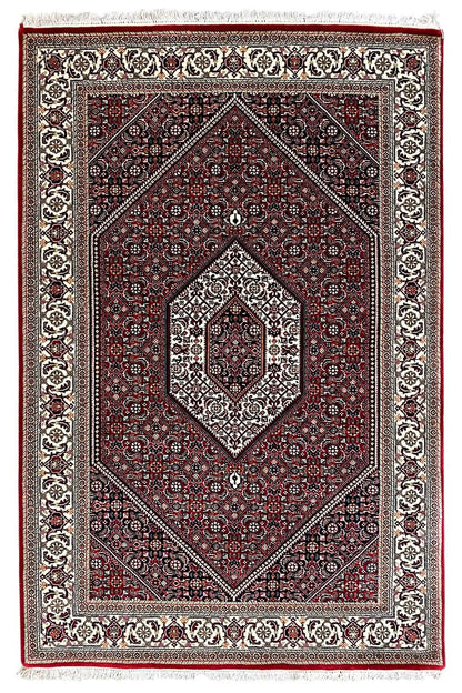 Rectangular Bidjar rug with a red central medallion and white border