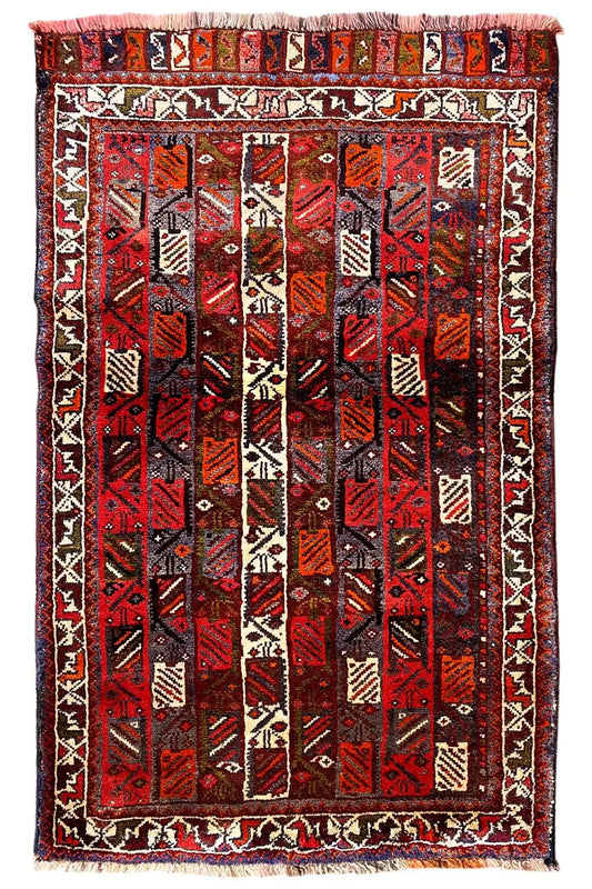Rug with a red center and black pattern, beige border with decorative stripes