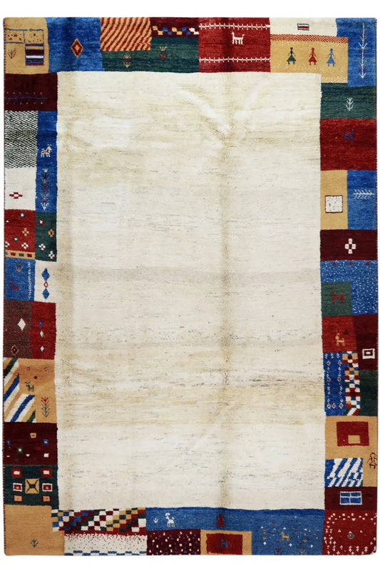 Gabbeh rug, rectangular: cream-colored field with a blue and red patchwork border