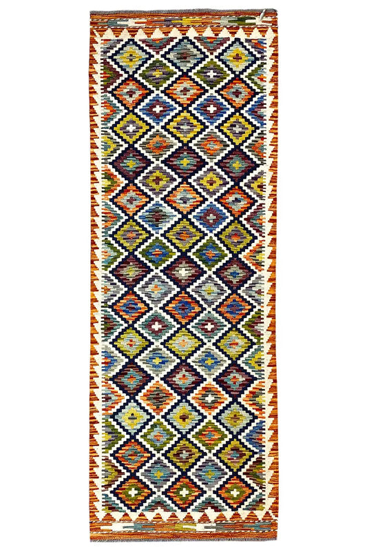 Rectangular kilim runner with a colorful diamond and zigzag pattern