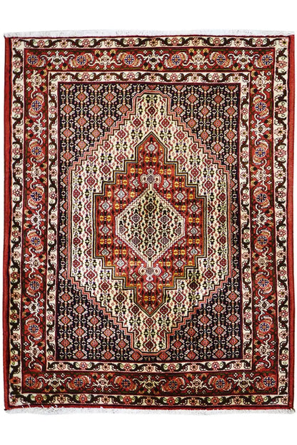 Carpet with a red border, dark blue background, and central medallion with ornaments