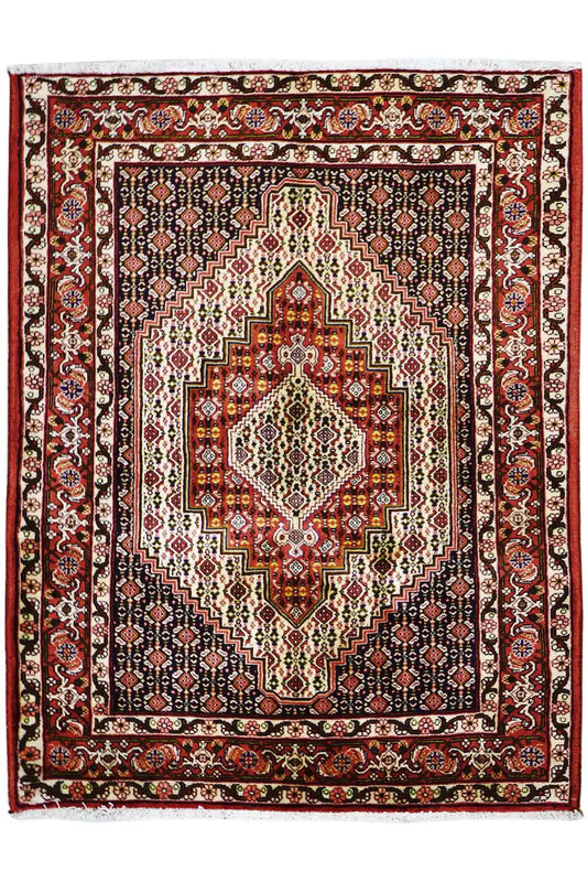 Carpet with a red border, dark blue background, and central medallion with ornaments