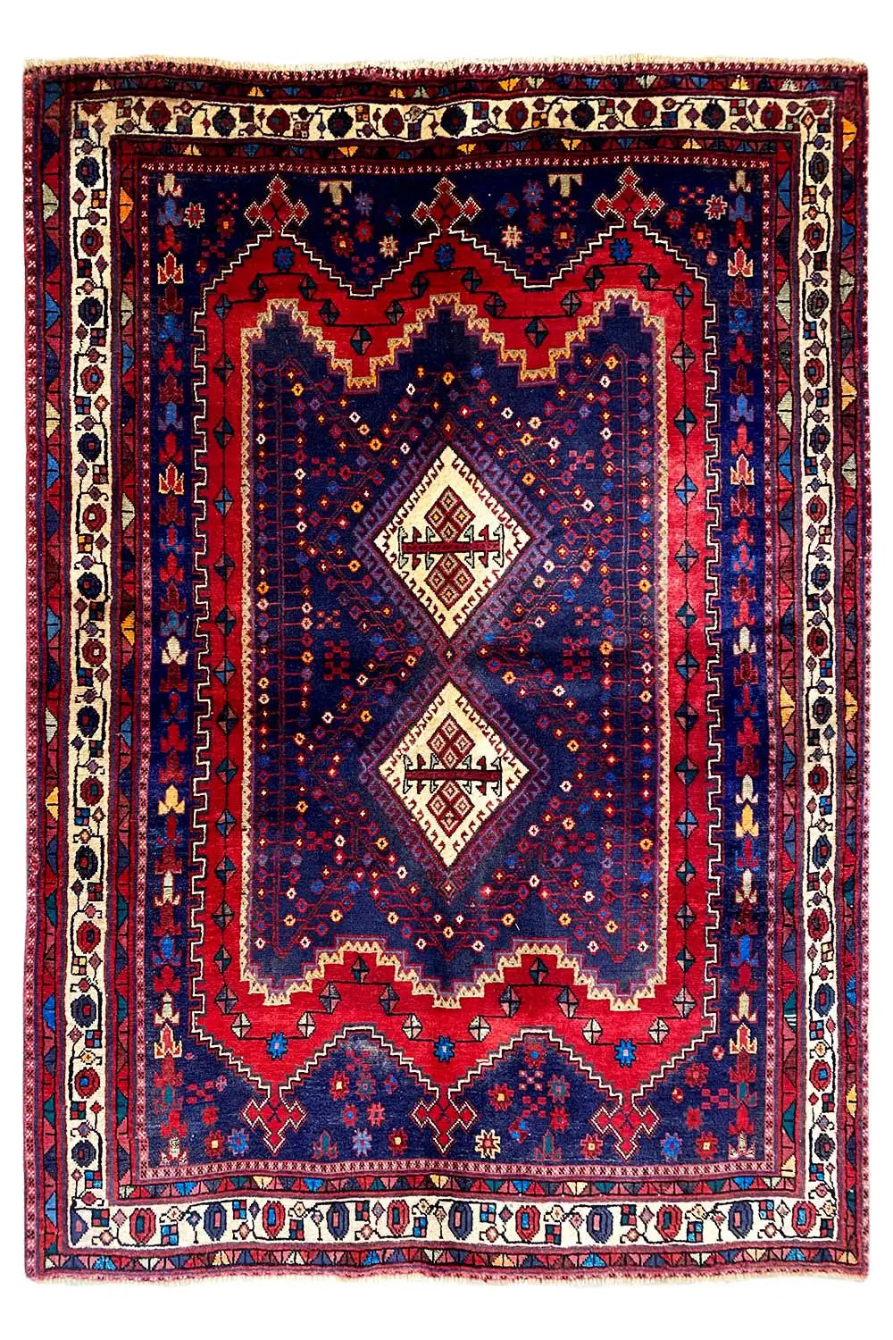 Sirjan rug with a symmetrical central medallion and multicolored border trim
