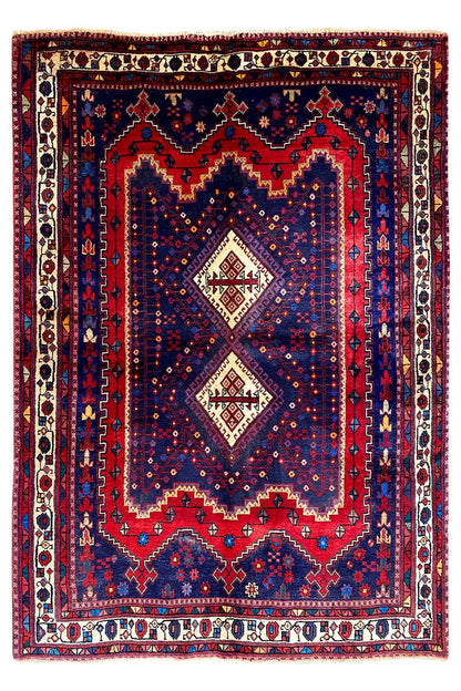 Sirjan rug with a symmetrical central medallion and multicolored border trim