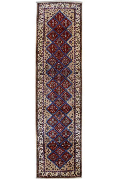 Oriental rug with a rectangular border and diamond ornaments in blue and red, beige