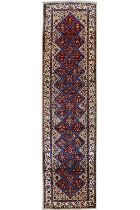 Oriental rug with a rectangular border and diamond ornaments in blue and red, beige