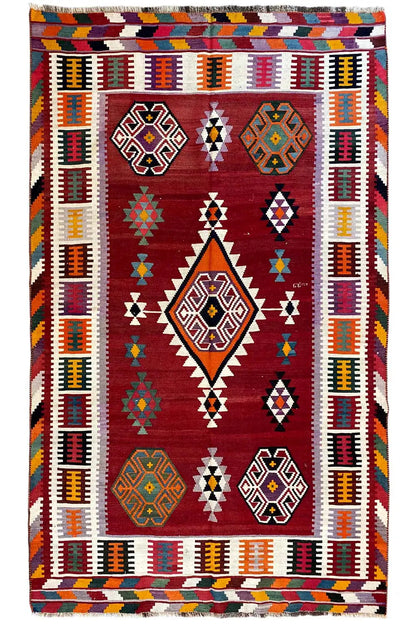 Kilim Qashqai rug, red background with colorful diamond motifs and a multicolored border