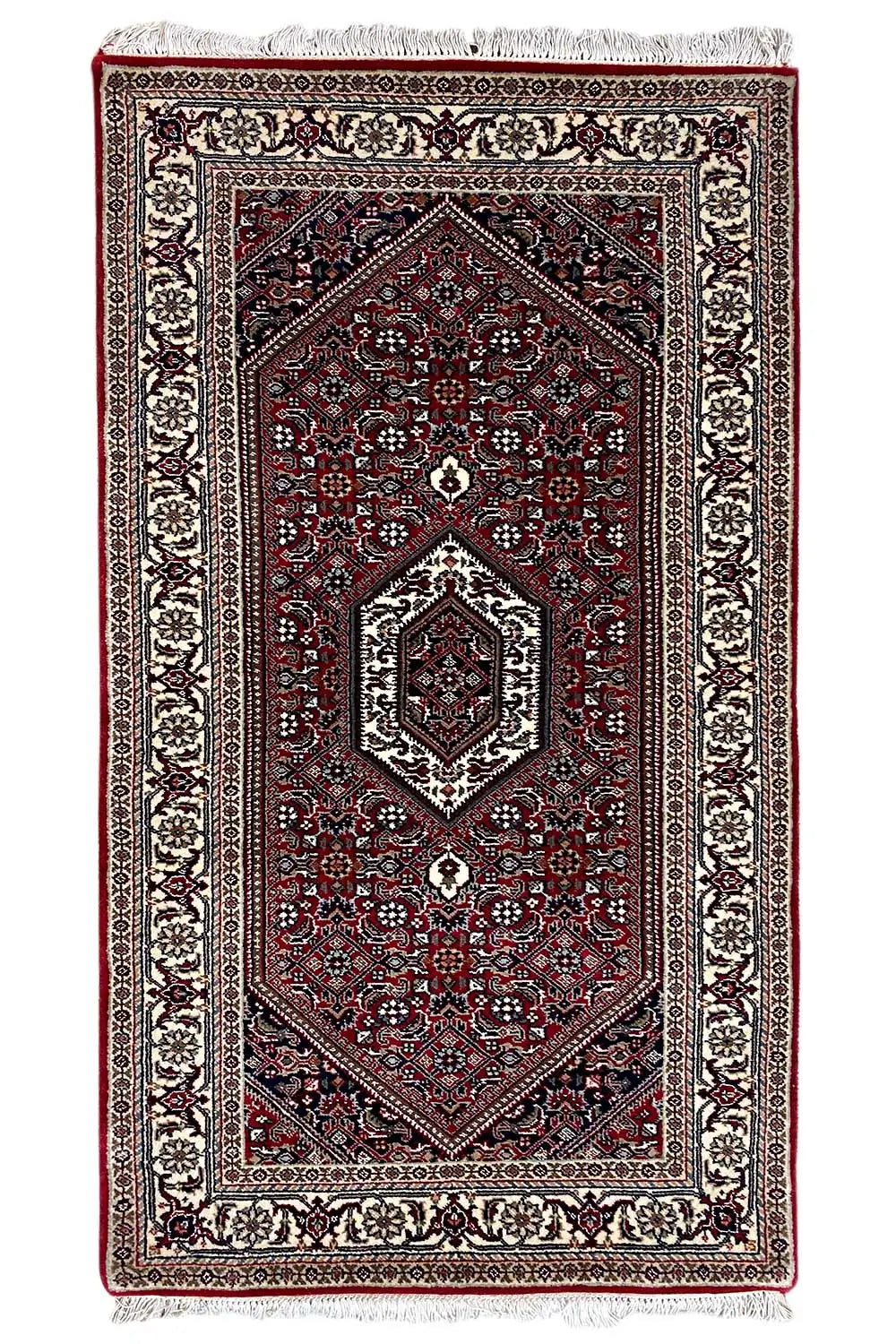 Bidjar rug, rectangular, dark red with medallion and fringe