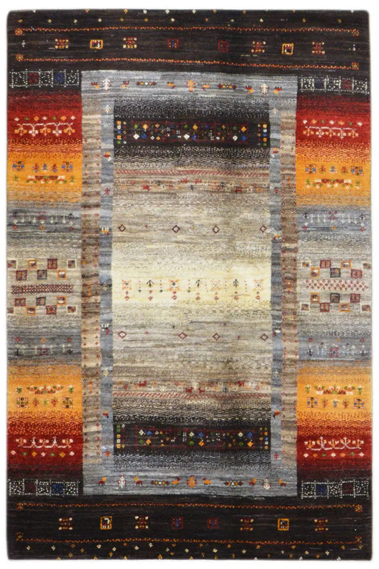 Gabbeh rug with a broad border pattern and a light central motif, black-brown edge