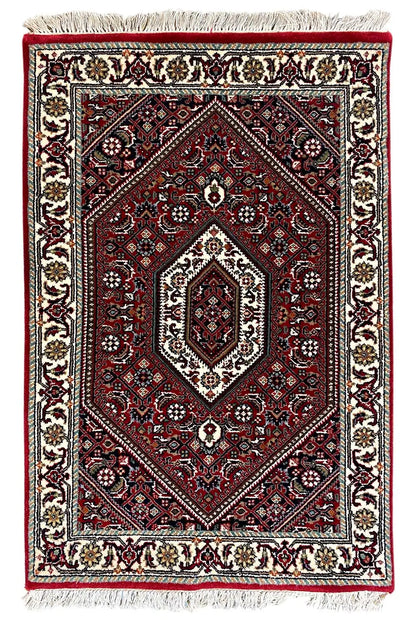 Bidjar rug 93x62 cm, rectangular, red medallion, cream-colored border, fringes