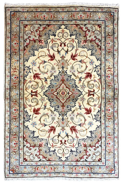 Beige Oriental rug with a central medallion, blue border, and red floral details