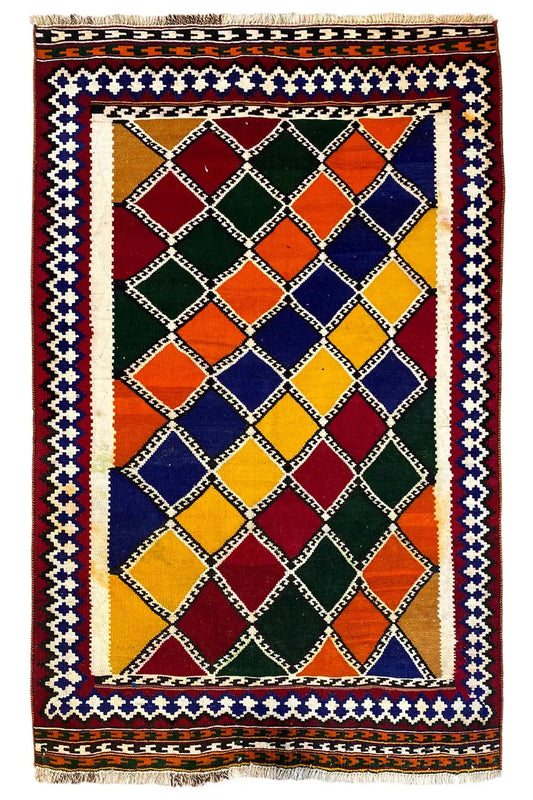 Rectangular kilim rug with a diamond grid in red, blue, green, and yellow