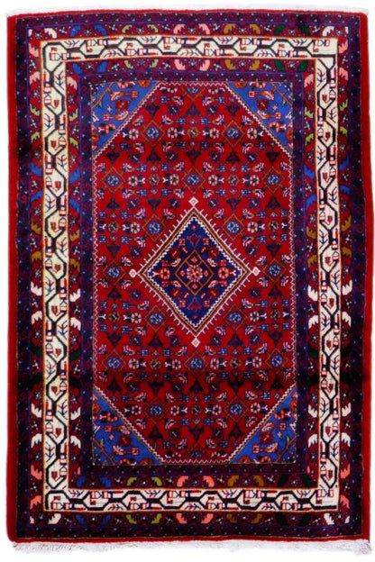 Dark red Oriental rug with a blue border, red medallion, and white edging, rectangular
