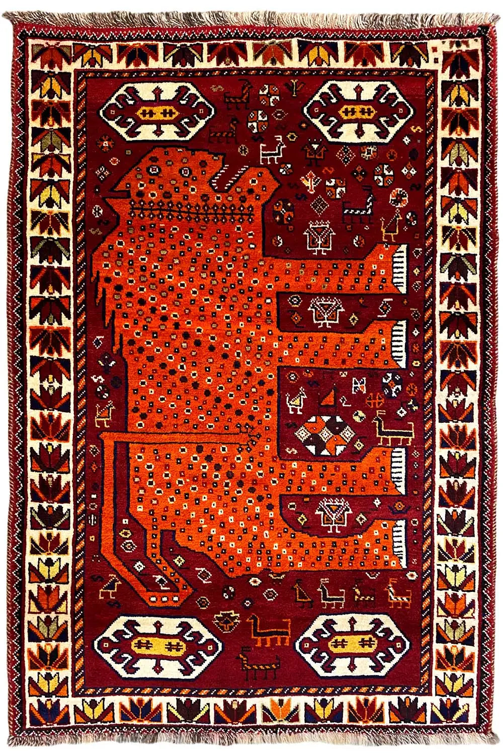 Gabbeh rug, burgundy and orange, large patterned panels, decorative border, fringes at the corners