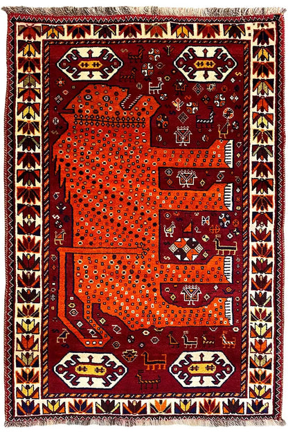 Gabbeh rug, burgundy and orange, large patterned panels, decorative border, fringes at the corners