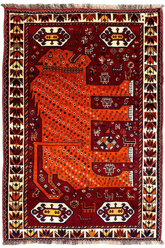 Gabbeh rug, burgundy and orange, large patterned panels, decorative border, fringes at the corners