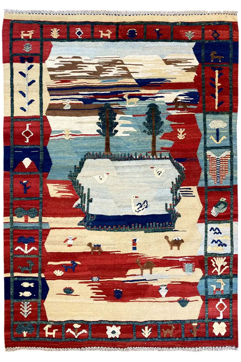 Kilim Qashqai rug with a red frame, blue border band, and landscape motif in the center