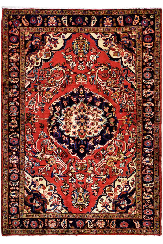 Hamadan rug with red field, blue-red border, and central medallion