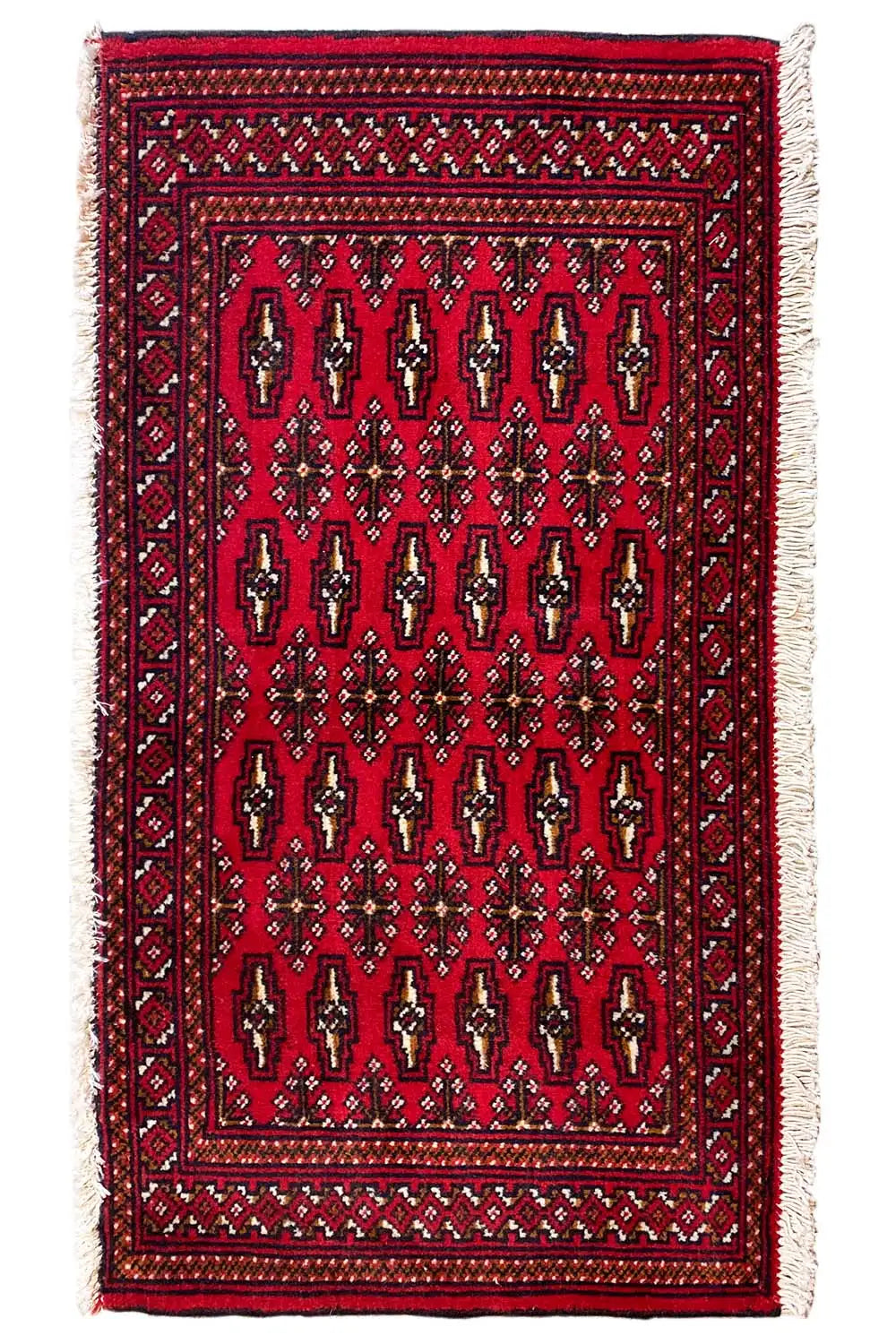 Turkmen carpet 110x51 cm with a dark red field, decorative border and light fringes