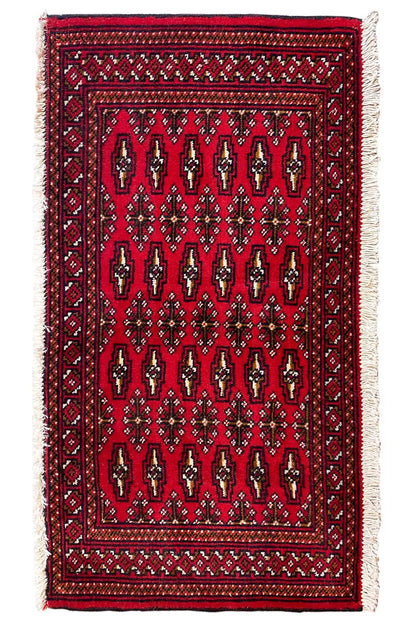 Turkmen carpet 110x51 cm with a dark red field, decorative border and light fringes