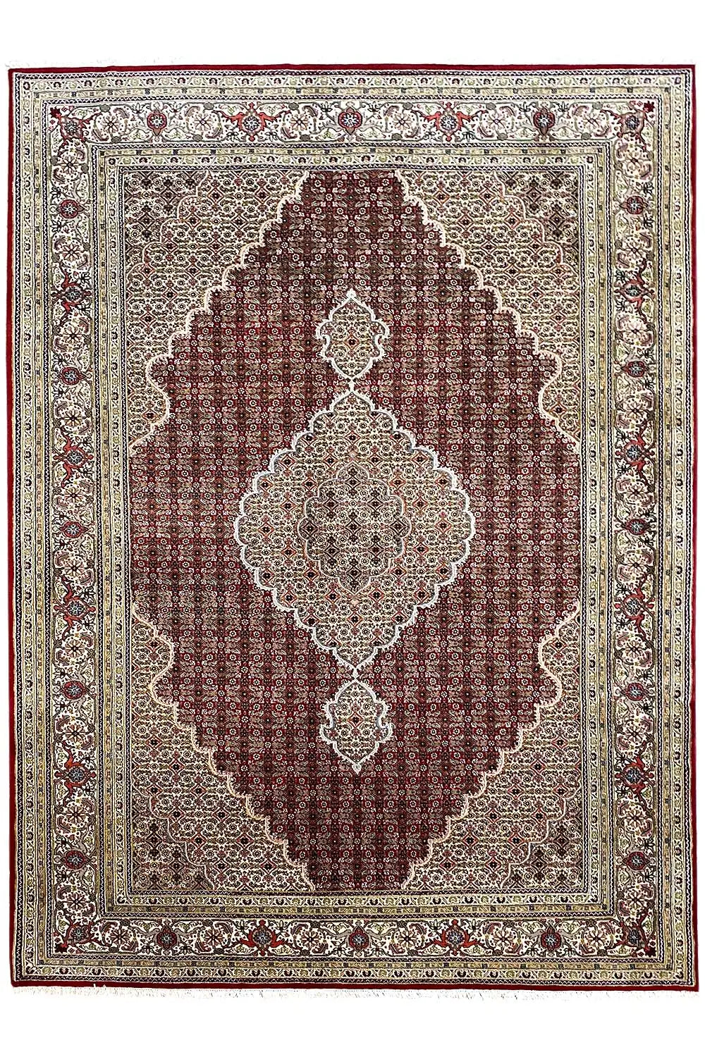 Indo Tabriz rug with a red central field, border, and medallion motifs