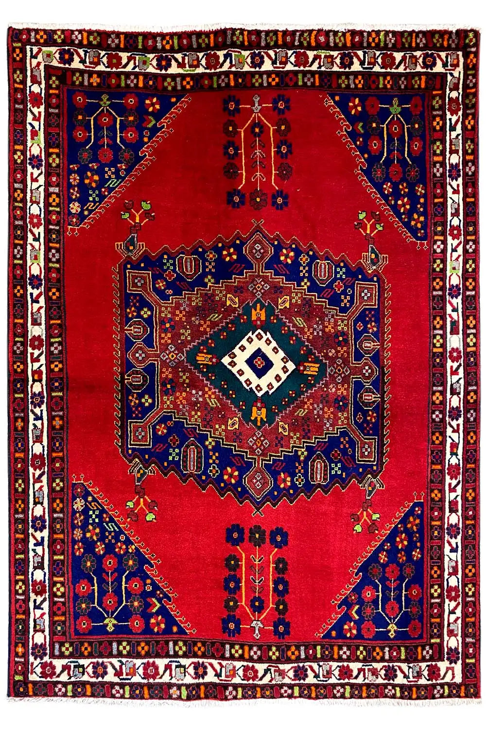 Rug with a central diamond medallion: red background, blue ornament and border