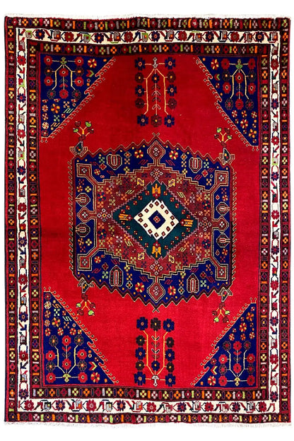 Rug with a central diamond medallion: red background, blue ornament and border