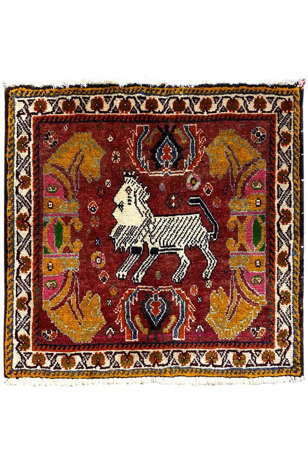 Rug with a red central motif, white horse, and wide ornamental border