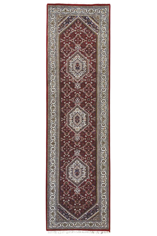 Bidjar runner, long and narrow: burgundy with decorative motifs and a light border frame.
