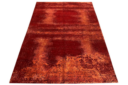 Rectangular red rug with striped gradient pattern