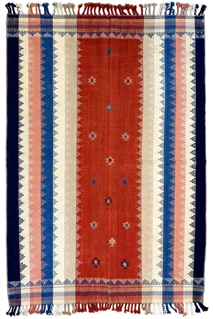 Striped rug with a red central band, blue side stripes, and fringes at the corners