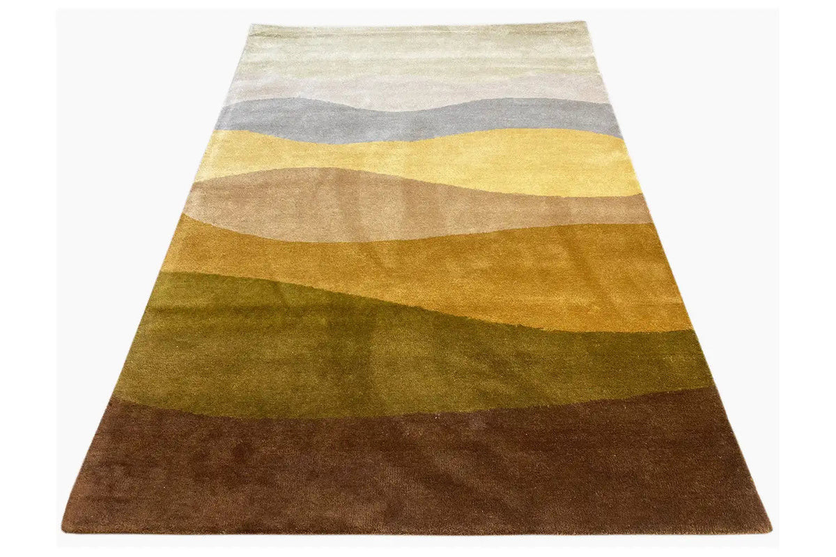 Hand-tufted rug 150x200 cm, lying at an angle, wavy stripes in yellow, gray, and brown