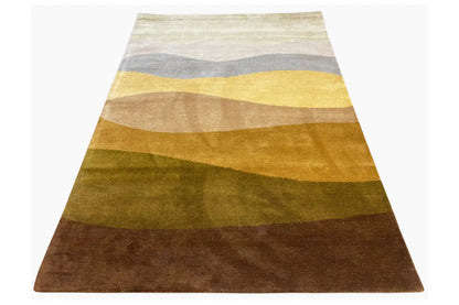 Hand-tufted rug 150x200 cm, lying at an angle, wavy stripes in yellow, gray, and brown